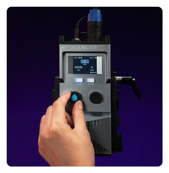 someone adjusting the nanlite fc 500c using the powercontroller