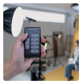 someone adjusting the nanlite fc 500c using the remote controller