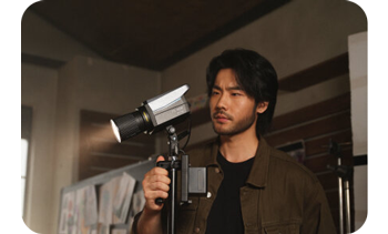 photographer looking at Nanlite FC-60B on light stand 