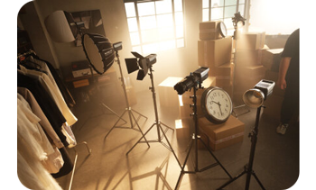Nanlite series of LED COB lights with different lighting modifiers standing in photography studio with wooden flooring