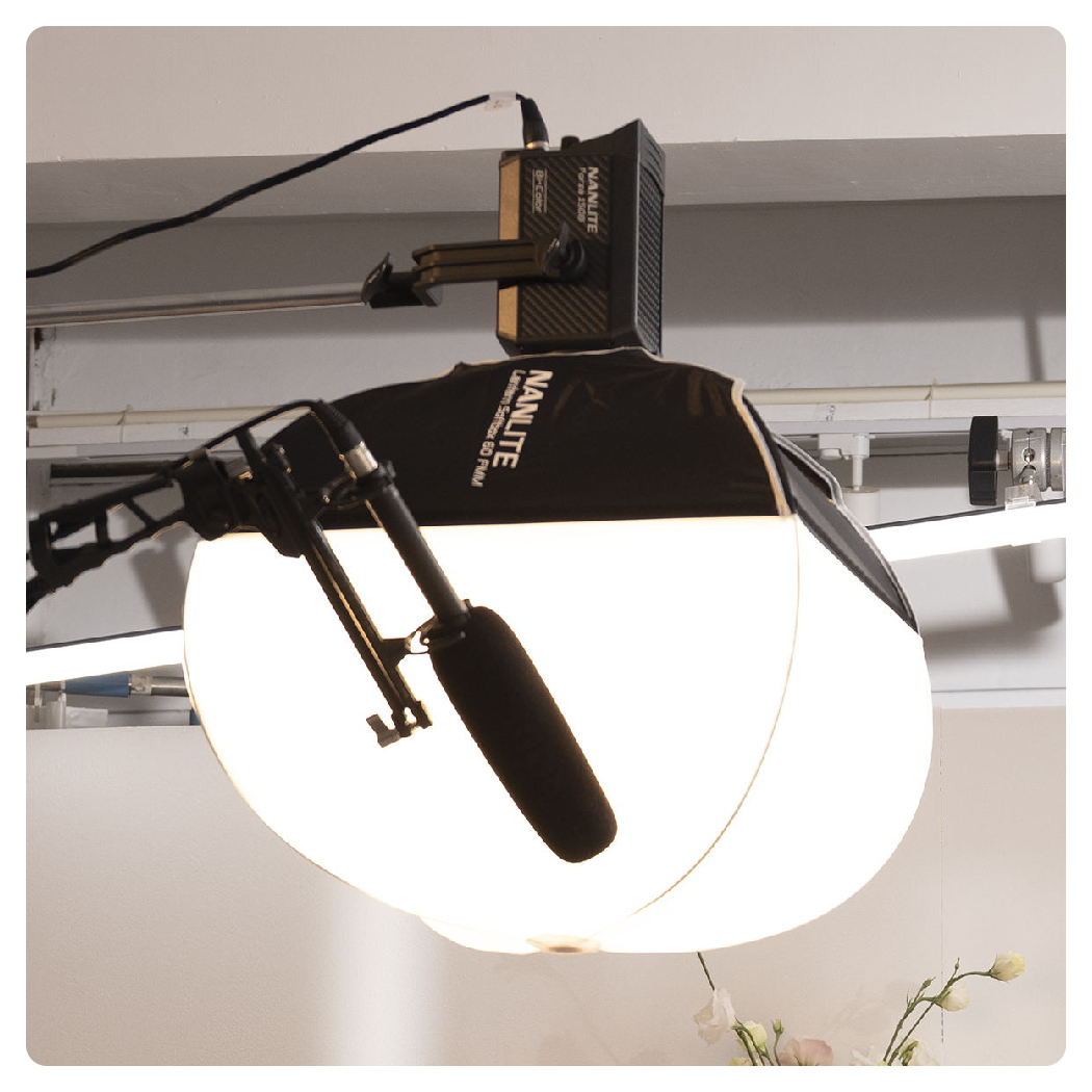nanlite forza 150 b attached to a rig next to a boom mic