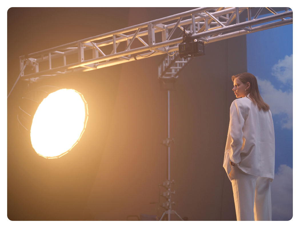 nanlite forza 500b ii in use in a studio with a woman in a suit under the light