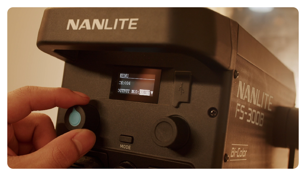 someone adjusting the cct on the nanlite fs 300b