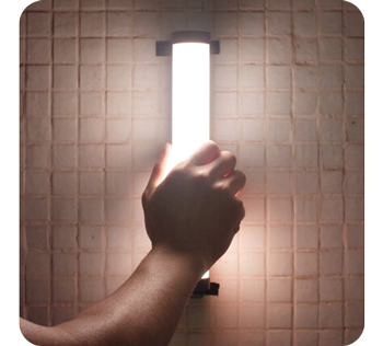 Person mounting Pavotube ii 6C led tube to wall mounting clips on tiled bathroom wall