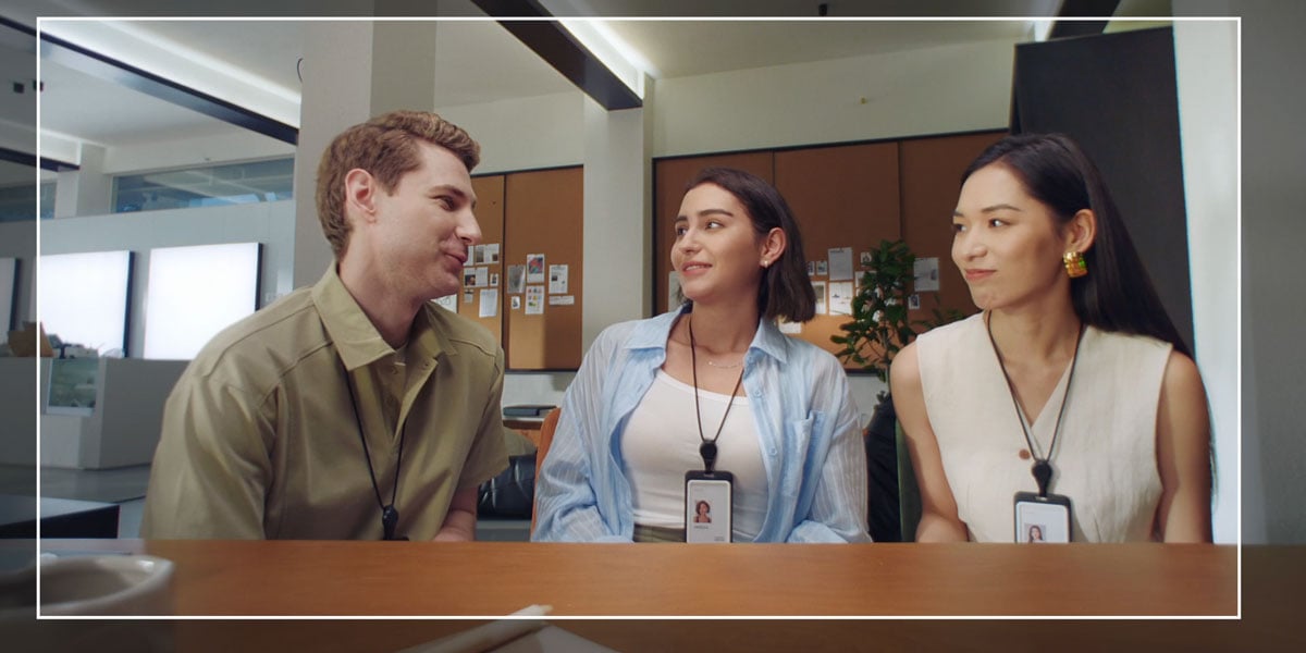 3 people sat at a desk using the obsbot meet flip group mode