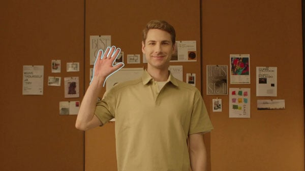a man making the ai auto framing gesture