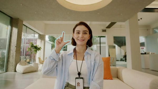 a woman making the zoom gesture