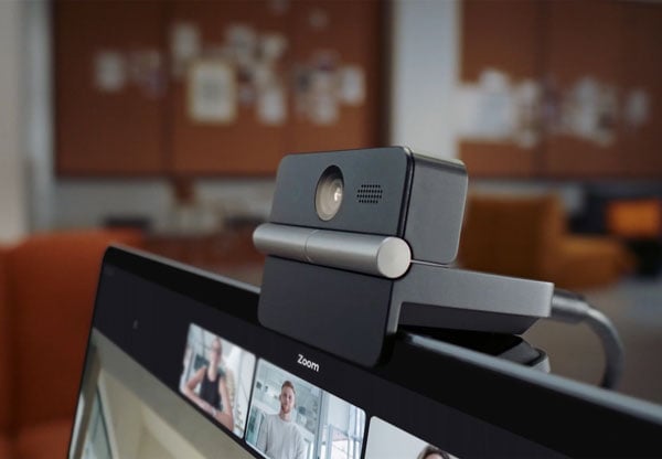 obsbot meet flip clipped to the top of a laptop