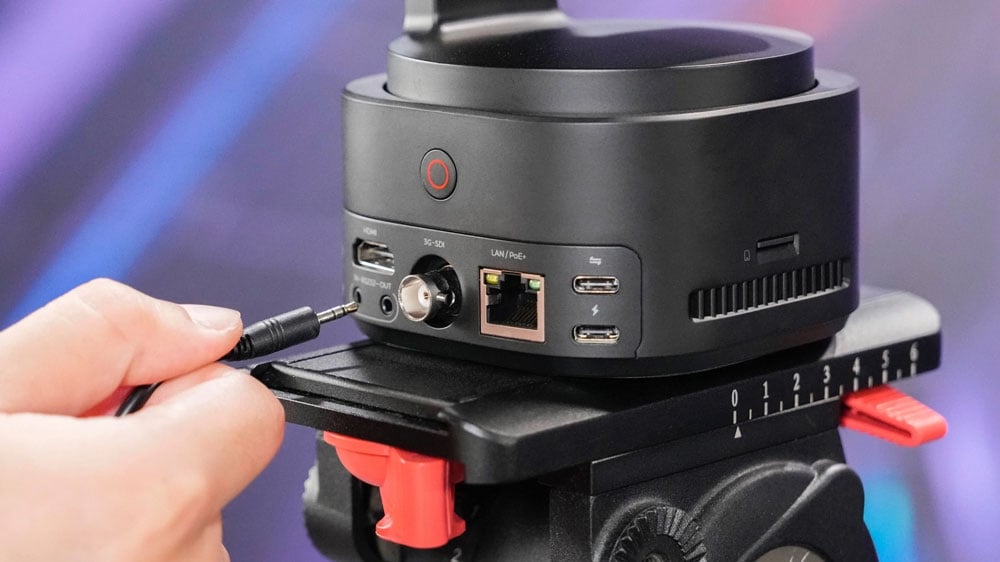 3.5mm cable being plugged into the back of the obsbot ptz camera