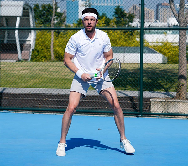 low iso example image of a man playing tennis