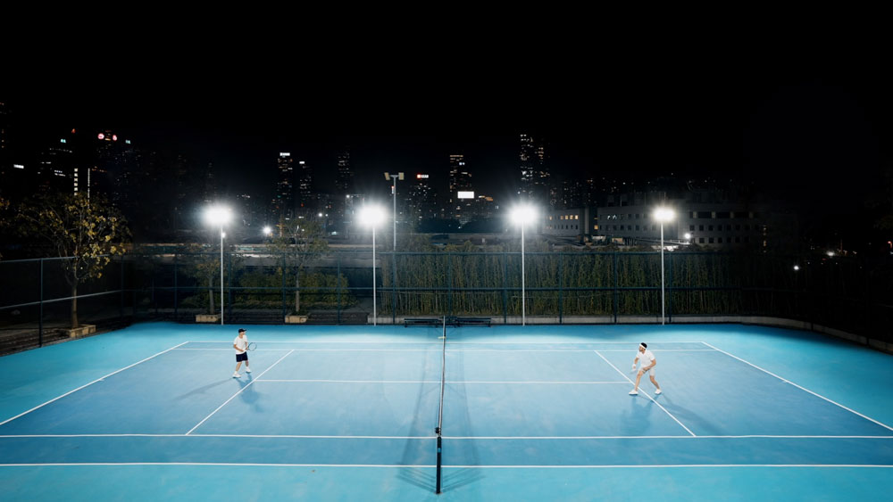 nightview example of a tennis match at night time