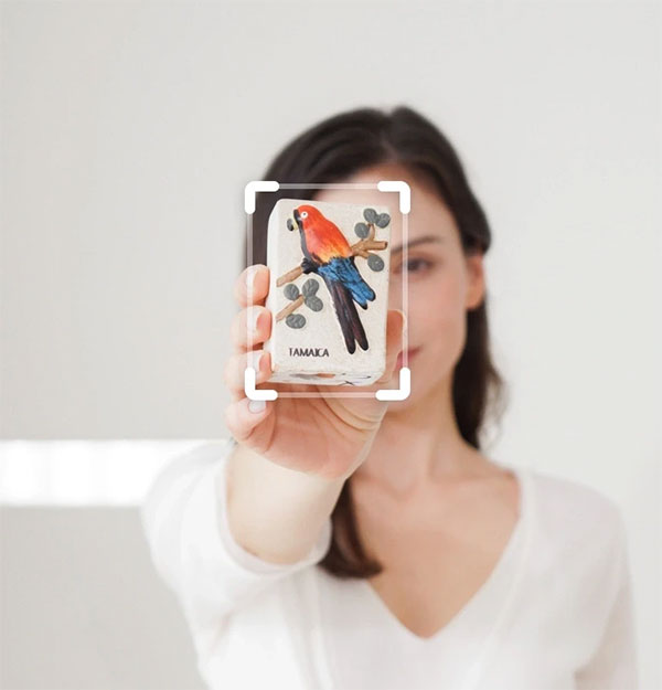 example of the ptz camera focusing on a card a woman is holding in front of her