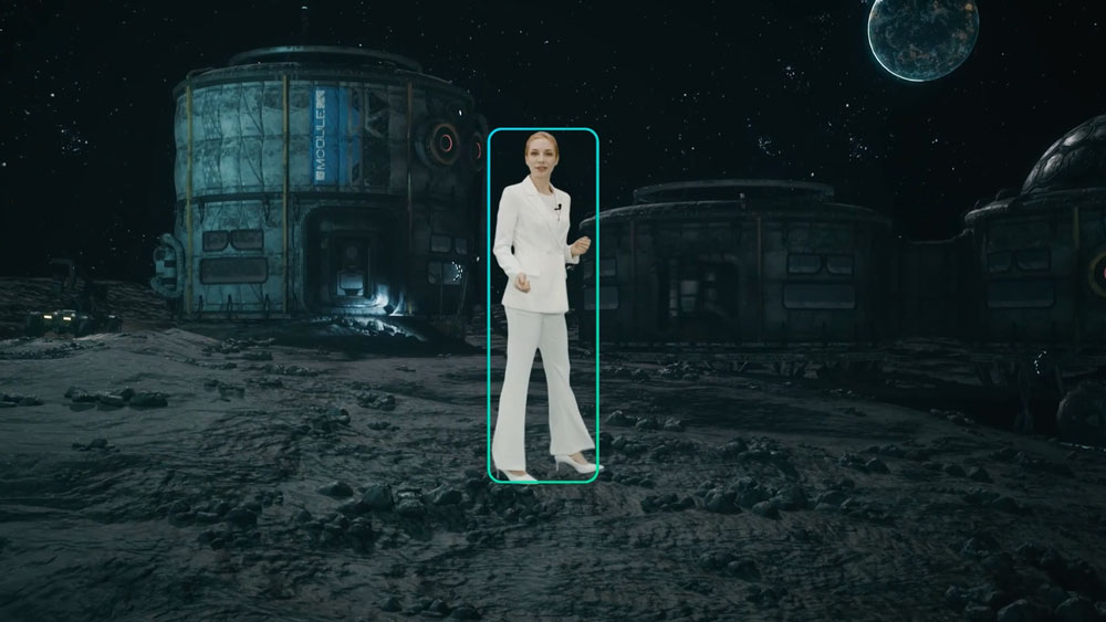 a woman being tracked in a virtual production studio showing a moon base using the ptz camera