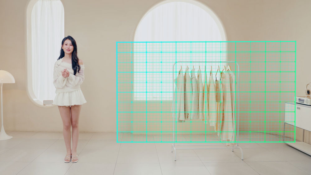 a woman ina  cram studio stood next to a tracking zone