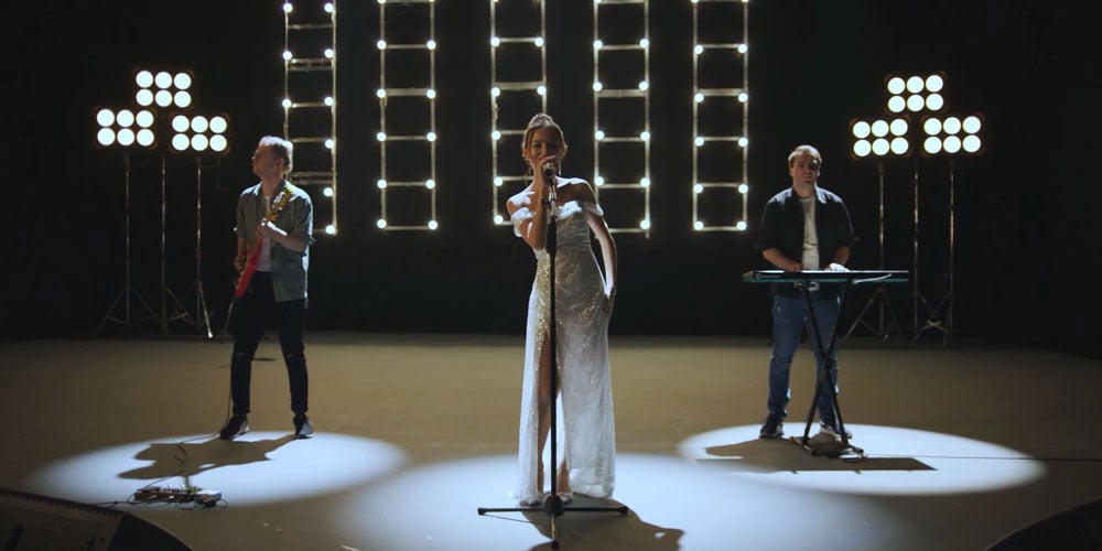example image of a band on stage under spot lights