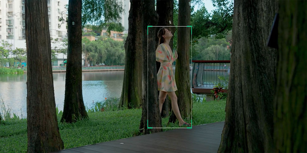 Obstacle-free tracking of a woman walking between trees near a lake