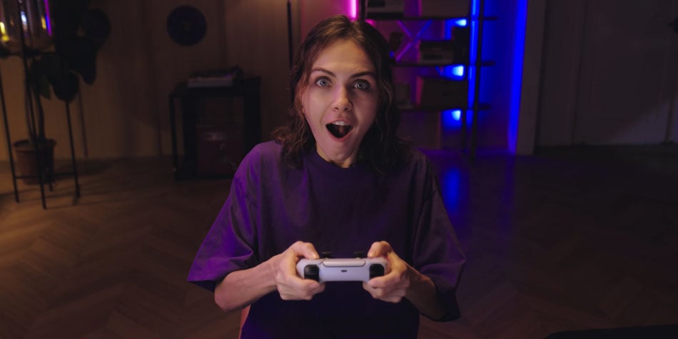 example image of someone using the obsbot tiny while playing video games in the dark