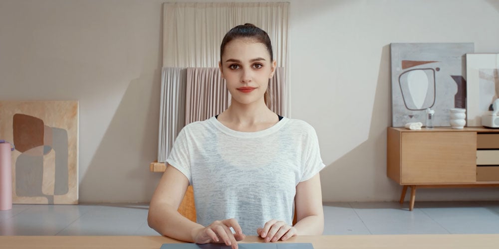 eample image of a woman at a desk using the obsbot beauty mode