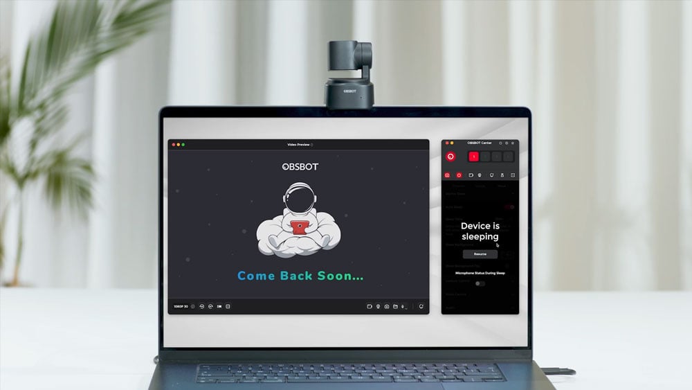obsbot tiny se in sleep mode on top of a laptop