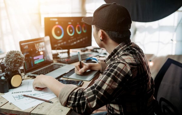 someone working at a desk using the OWC Express 4M2
