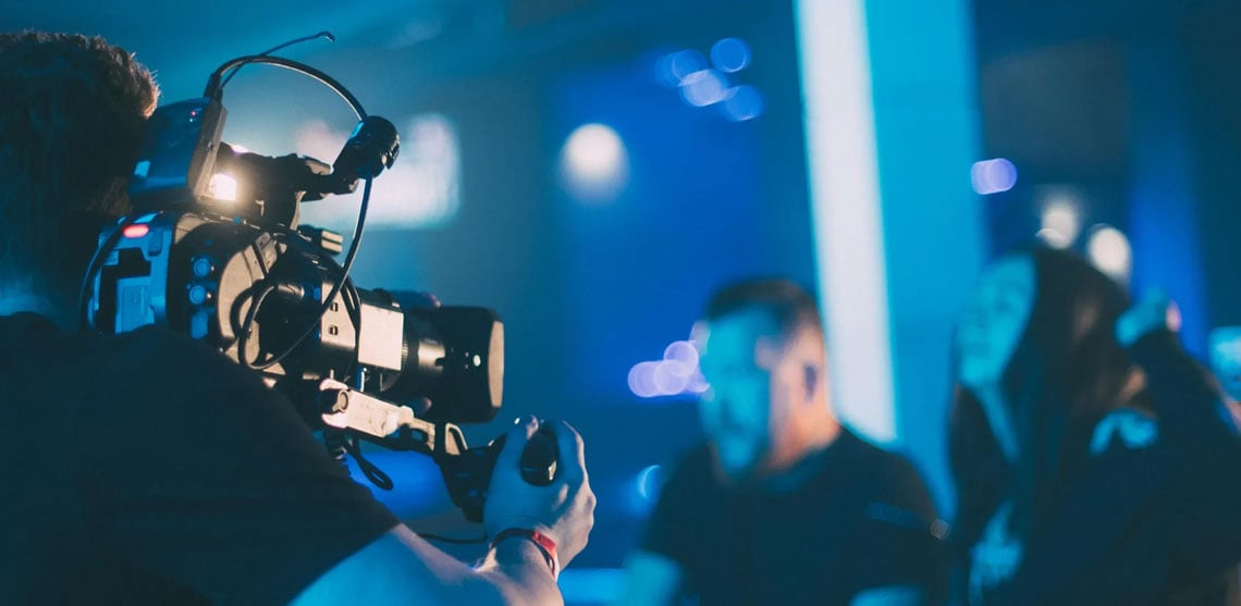 over the shoulder view of a camera man on set