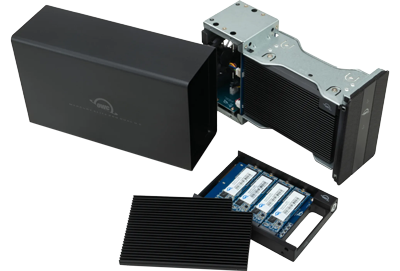 person installing NVMe SSD blade into OWC U2 Shuttle tray