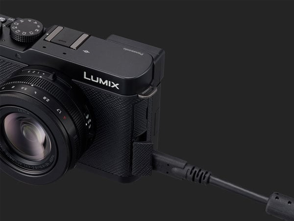 power cable being connected into the lumix l10 camera