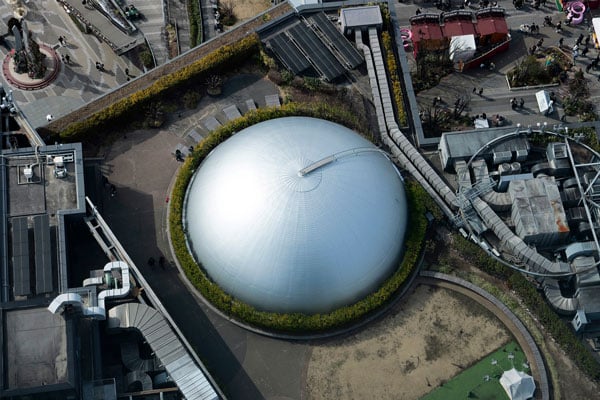aerial shot of a domed roof building surround by green hedges