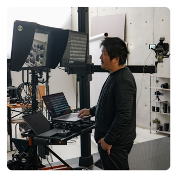 someone at a work bench using the Panasonic LUMIX S1II