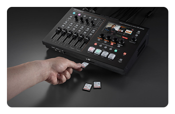 sdxc card being inserted into the live stream mixer