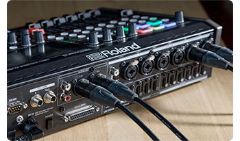 Close up photograph of Rolan VR-6HD XLR Audio connections with cables attached
