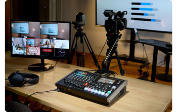 Roland VR-6HD with canon PTZ camera on tripod and multiview monitor used to capture live presentation
