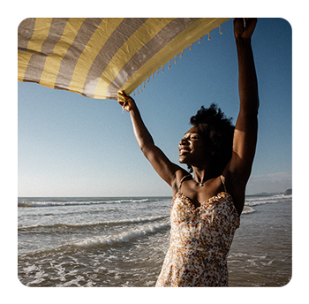 sample image of a woman on a beach taken with the samyang lens