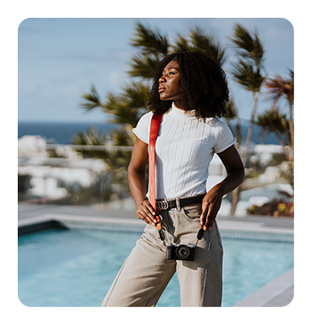 some one holding a camera with the samyang lens attached