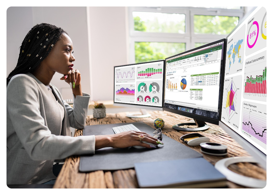 A woman with a home office setup including 3 4k monitors, Sonnet Echo 13 Triple 4K Display Dock