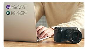 sony fx3 next to filmmaker working on silver laptop with sony catalyst logos
