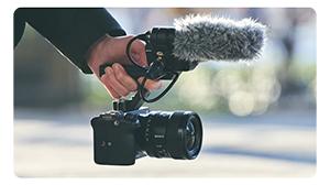 sony fx3 cinema camera being held by sony XLR microphone handle