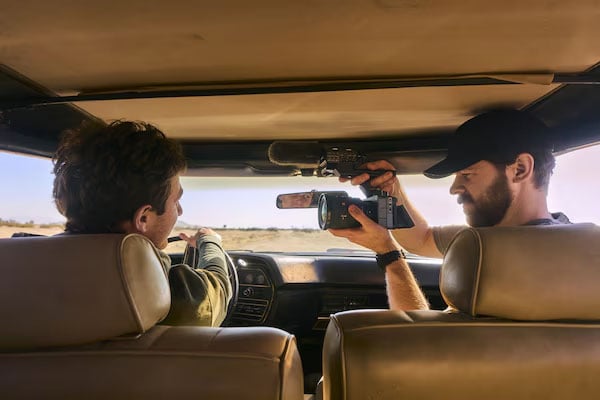 a man filming in a car using the sony fx5