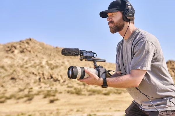 a man filming using the sony fx5 with the xlr handle