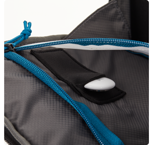 Close up image of tenba axis backpack airtag pocket with apple airtag