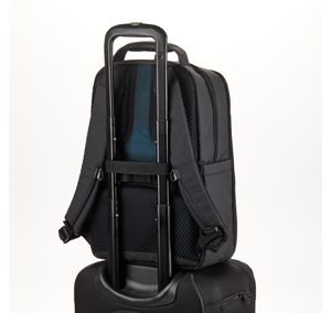 Image of Tenba Axis V2 RoadWarrior bag sat on roller suitcase with trolley handle fed through straps