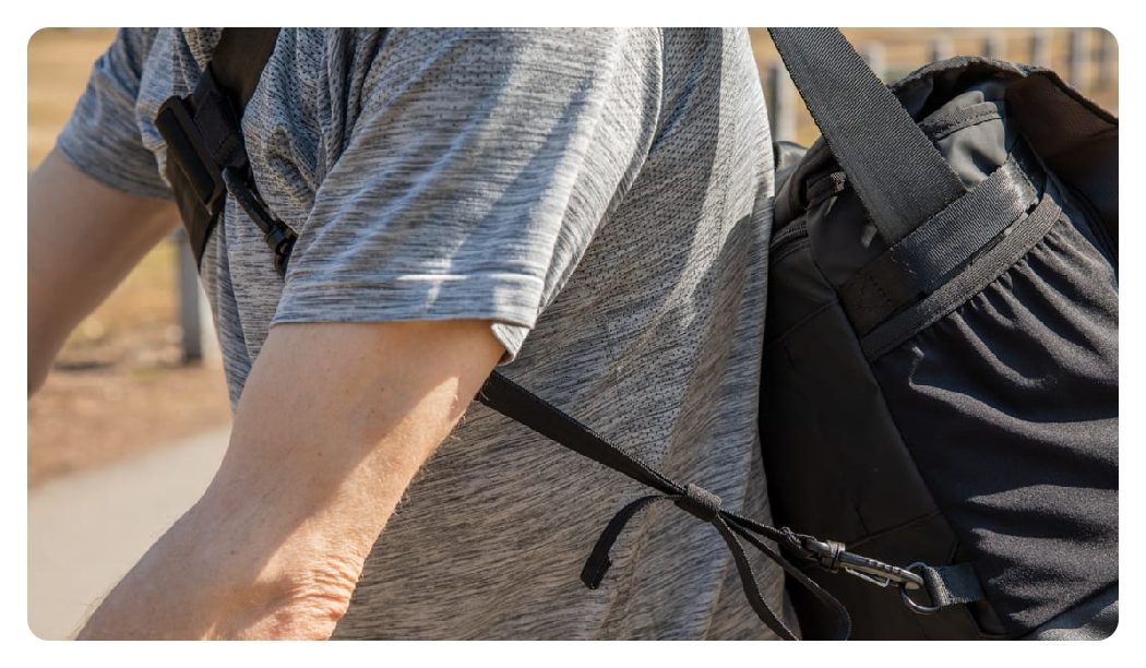 someone cycling with the tenba messenger bag