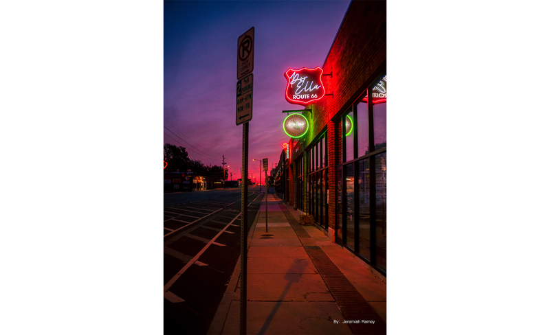 sample photograph of american steet with sign posts and route66 bar neon sign