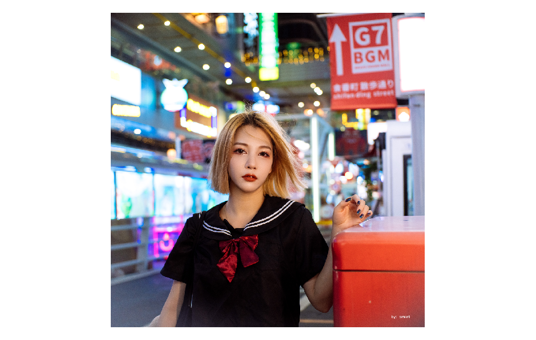 sample image of a woman in a well lit asian street taken with the ttartisan macro lens