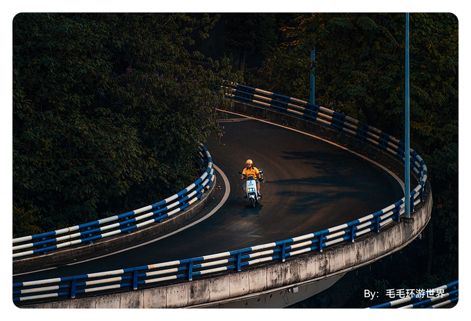 sample image of a man on a scooter driving down a road taken with the ttartisan telephoto lens