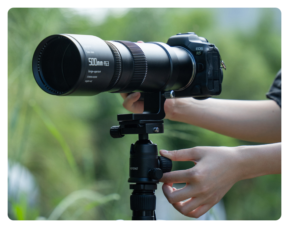 ttartisan telephoto lens attached to a camera and tripod