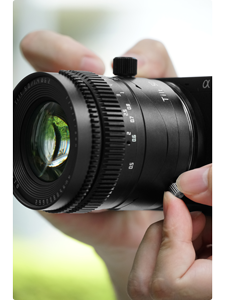 Photograph of person holding adjusting the rotation mechanism of TTArtisan 50mm F1.4 Tilt lens
