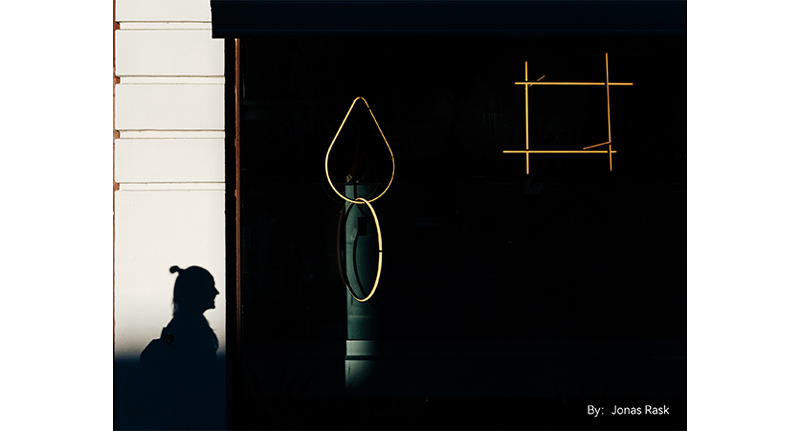 sample photograph of bamboo ring ornaments hanging in door way covered in black shadow