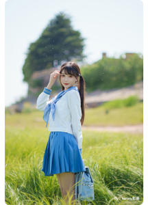 photograph of woman holding Fujifilm X-E4 with TTArtisan AF27mm F2.8 lens