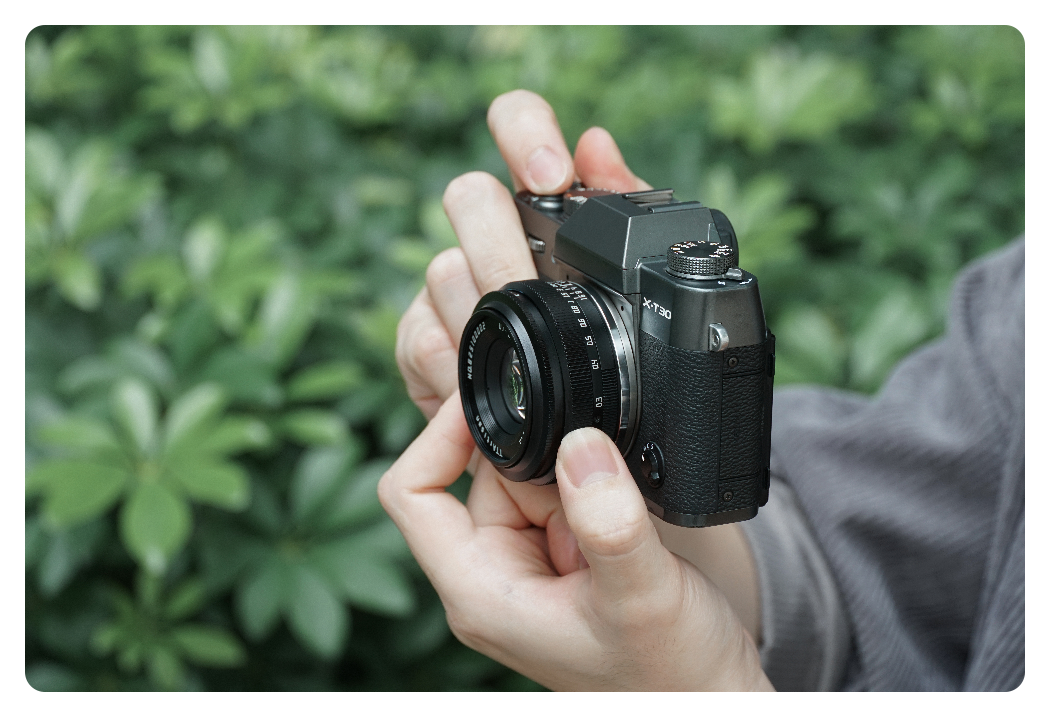 someone using the ttartisan 25mm f2 to take a close up image